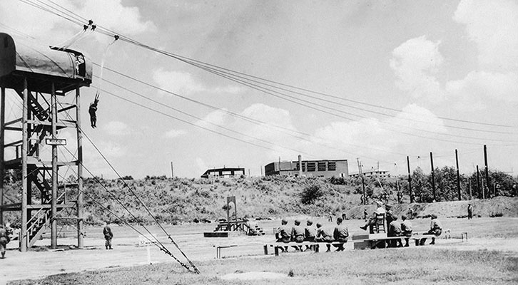 Since replaced by steel girder 34 foot jump towers, this photo shows the original towers built by acting SGT Michael Kunik and SFC James DuBois.
