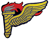 The original Army Pathfinder insignia was a cloth patch worn on the fatigue shirt or field jacket pocket and lower left sleeve of the Class A green uniform above enlisted service stripes.