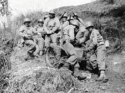 The 4.2 inch mortar being &lsquo;man transported&rsquo; on its carriage to a hilltop.