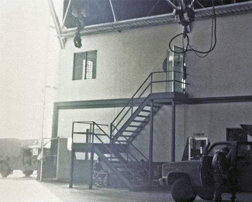 A second story office inside the hangar provided a place for facility employees to work once the camp was up and running. Before, it served as MAJ Cheek’s office.