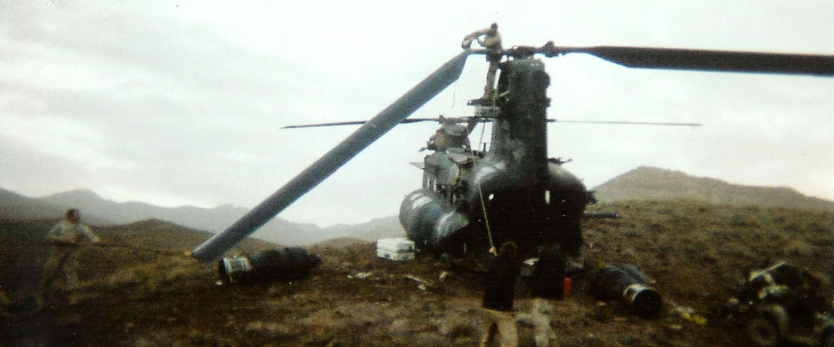 The recovery crew at work cutting the rear rotor blades.  Cutting them proved problematic and time-consuming when the blades bent down, forcing the crew to work them back and forth to help break them away.