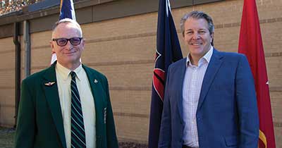 The author, Robert D. Seals, with Bradford F. Hicks, grandson of MG Robert T. Frederick, at the building dedication on 3 December 2021.