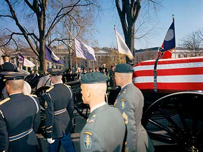 SF soldiers accompany the caisson during the two-mile procession from the White House to the Capitol Building in the early afternoon of Sunday, 24 November.