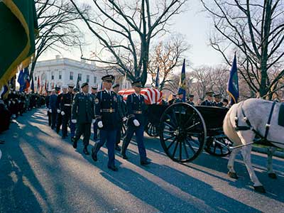 SF soldiers accompany the caisson during the two-mile procession from the White House to the Capitol Building in the early afternoon of Sunday, 24 November.