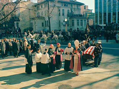 The casket arrives at St. Matthew's Cathedral, shortly after noon on 25 November.