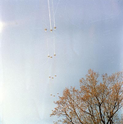 Fifty USAF and U.S. Navy aircraft, followed by Air Force One, conducted a flyover shortly after the arrival of the casket at the gravesite.