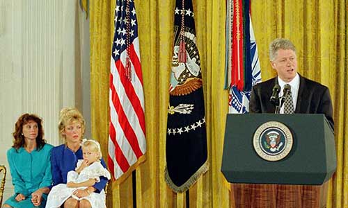 Gold Star wives Stephanie Shughart and Carmen Gordon accept the posthumous award of the Medal of Honor to their husbands, Randall and Gary, on May 23, 1994.