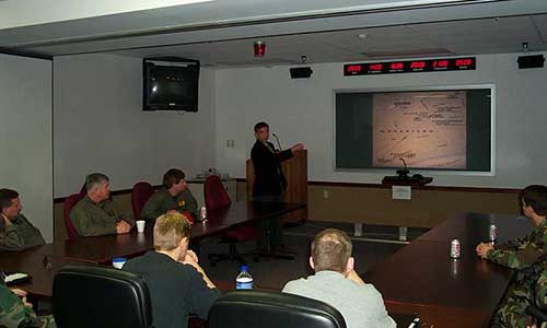 Eldard attends a briefing on the Battle of Mogadishu from Michael Durant, pilot of ‘Super 64” who was shot down and held captive for 11 days.