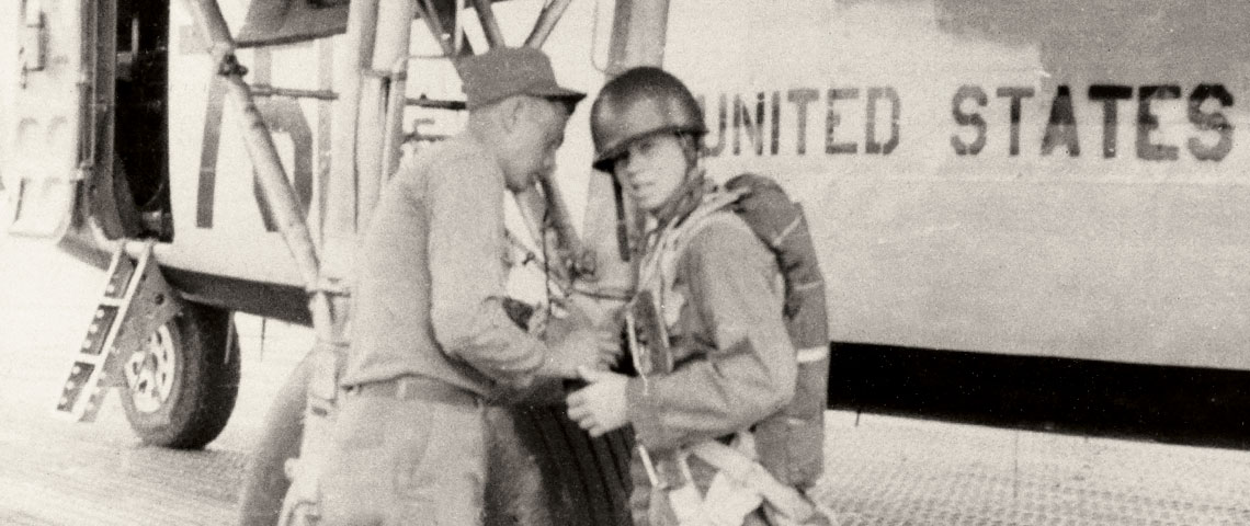 SGT Bozeman conducts a pre-jump inspection on CPL Jesse E. McDonald to ensure his parachute and other equipment will function safely during the jump.