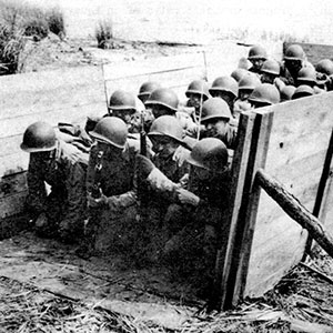 The solution to landing craft shortages was to practice debarking from wooden boat mock-ups