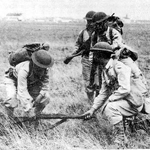 Soldiers held rifles at the down ramp height to teach men to jump down onto the beach from their landing craft. Note that they are carrying .30-06 M1903 Springfield rifles.