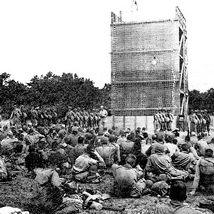 &lsquo;Dry&rsquo; cargo net training on the Camp Edwards towers prepared soldiers to climb down from troop transports to landing craft and get back aboard the ship if weather prevented landings.