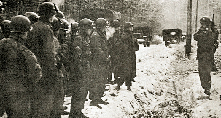 CPT Paul C. Doster (right) conducts an After Action Review following a field problem.