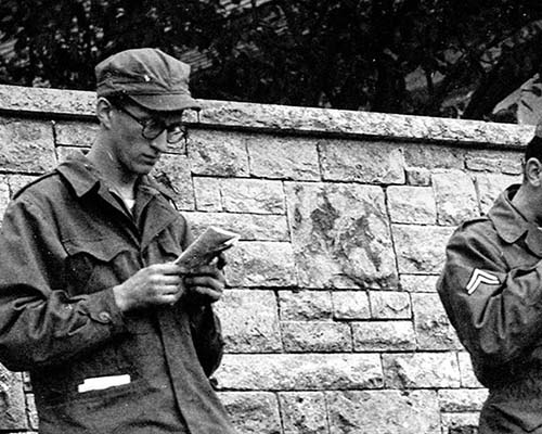 5th L&L Company: Germany 1951-52. Reading leaflets during field exercises in West Germany