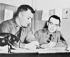 Publication Platoon Leader 1LT Dan Hicks, Jr., and his Platoon Sergeant, SFC Karl Conant, review their unit’s weekly training schedule.