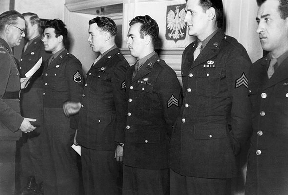 The OSS BARDSEA contingent as it is awarded the Polish airborne wings and certificate. SGT Skokoski is second from right.