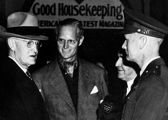 MG Hilldring, in uniform on the right, talking to President Harry S. Truman, left.