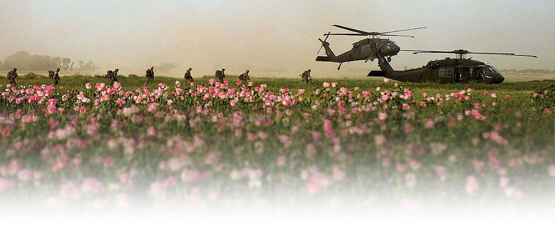 U.S. Special Forces team members with Special Operations Task Force - South board two UH-60 Blackhawk helicopters following a clearing operation in Panjwa'i district, April 25, in Kandahar province, Afghanistan