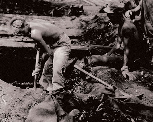 Medical personnel excavate bodies of American soldiers from Shelter A.