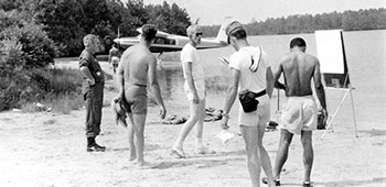 MAJ &lsquo;Jerry&rsquo; Jensen, sans flight suit, presented the float plane orientation to 3/5th SFG personnel.