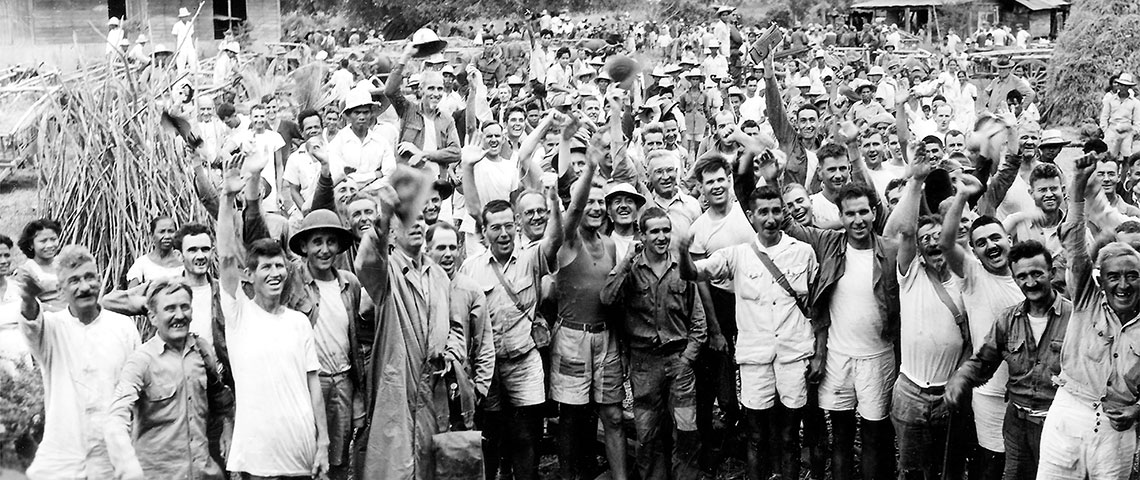 Former POWs from the Cabanatuan prison camp celebrate their rescue in the town of Guimba, Luzon, Philippines.