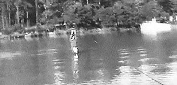 A Special Forces soldier traverses the pond on a &lsquo;slide-for-life&rsquo; cable before dropping safely into the water.