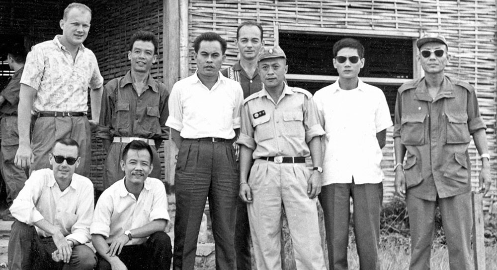 2LT Ray Ambrozak and interagency partners from U.S. Operations Mission and USIS pose with Laotian counterparts in Luang Prabang.