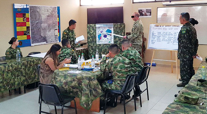 CPT Bronson* makes a presentation in a typical classroom environment at the PSYOP Course.