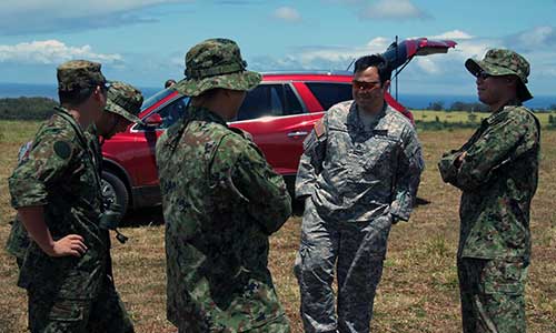 One of the unintended benefits of SILENT EAGLE 2011 was the sharing of experiences. Here, medical personnel discuss different ways to stabilize wounds.