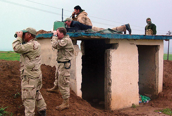 Team members call for close air support during the battle of Ayn Sifni. The ability to quickly bring in U.S. air power was a decisive factor in many of the battles.