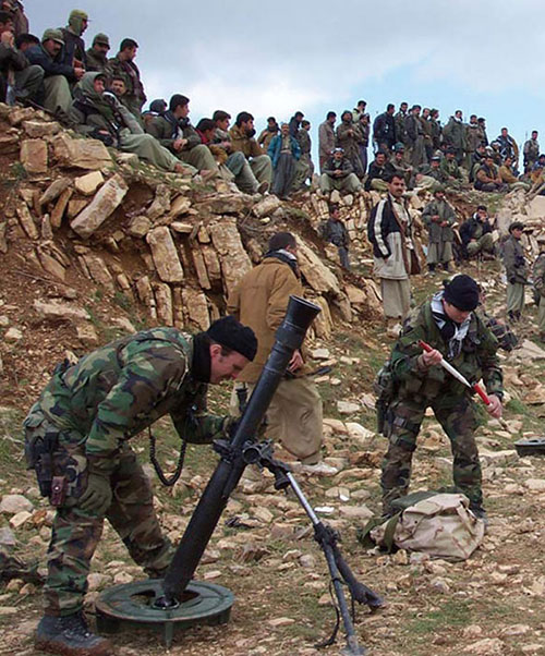 Special Forces 81mm mortar teams supported the Peshmerga forces during the ground assault. The Peshmerga assigned to the Blue assault route provided plenty of supervision as the SF team set up their mortars before the assault.