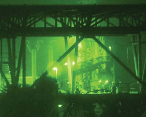 Embedded media and combat camera crews documented SOF liberation of Iraqi offshore gas and oil platforms (GOPLATS) in the early days of OIF. Night vision goggles enabled coalition soldiers to approach their objectives in the dead of night.