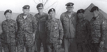 SGM Richard Henrickson, SSG Dewberry, LTC Lim Dong Won (retired LTG), SFC William Taylor, and SGM Chay at the ROKA SF command post during a field exercise circa 1970&ndash;73