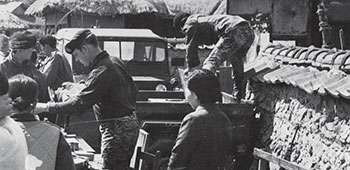 SSG Phillip Quinn (medic) sets up for MEDCAP with ROKA Special Forces circa 1970&ndash;73.