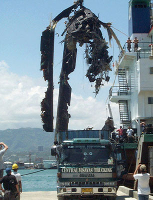 A salvage operation recovers one of the rotors from the crash of Wild 42.