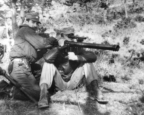 Sergeant First Class Joe Pagnella coaches Lieutenant George Atcheson on the 57mm anti-tank recoilless rifle.