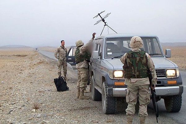 The convoy stopped in the flatlands for a communications check unaware that there was a blizzard raging just miles up the road. The vehicle closest to the camera, with the satellite communications antenna on top is a Toyota Hilux.