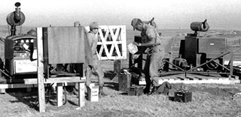 Installing the generator power distribution system. The generators provided the power for the 50,000 watt radio station.