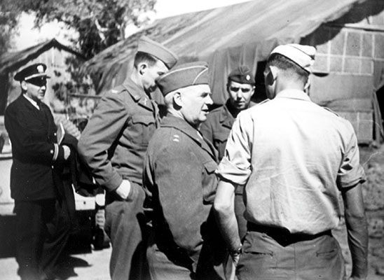 Major General William J. Donovan was the head of the Office of Strategic Services. Here he is seen in 1945 talking with Colonel Ray Peers.