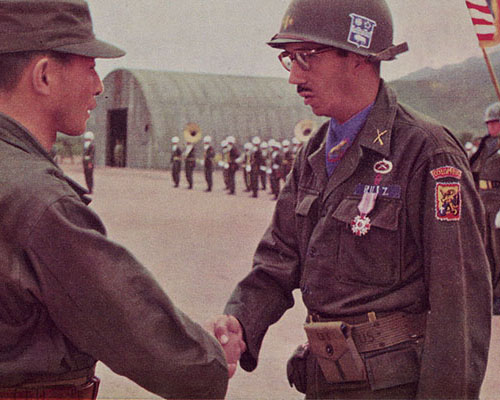 Lieutenant Colonel Alberto Ruíz Novoa being congratulated by General Paik Sun Yup, Chief of Staff, Korean Army, after being awarded the &ldquo;Ulchi Order of Military Merit&rdquo; at the 7th Infantry Division headquarters on 19 June 1953.