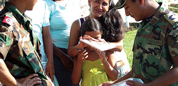 Colombian soldiers pass out “school kits.” The school kit is a notebook that children can use for school, some include pencils and other items. The notebook cover is designed by Colombian and U.S. Psychological Operations, usually with a anti-drug message or theme.