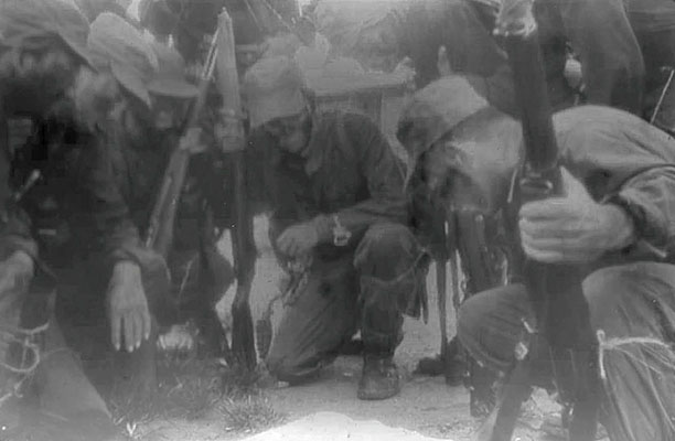 Colombian Lancero students are briefed for a night operation.