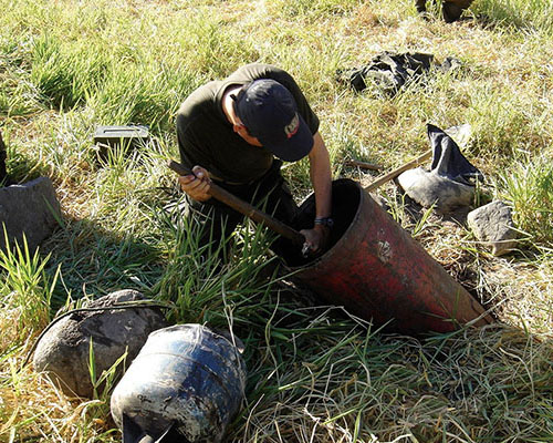 Colombian demolitions experts prepare a demonstration of the “barbeque bomb” made from propane tanks.