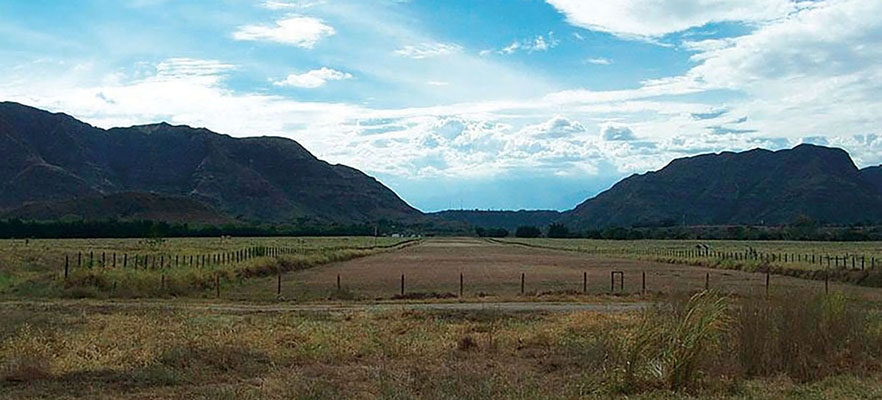 The rolling terrain of the Pijaos training area. The buildings in the background are the original estancia, now the home of the CNP officer in charge of the training area.