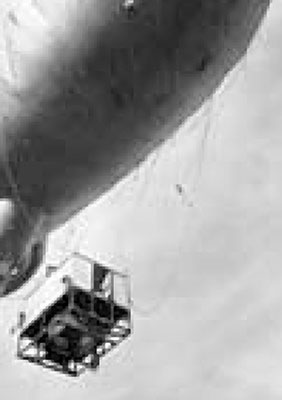 Wicker gondola basket with &ldquo;joe hole&rdquo; attached to barrage balloon.