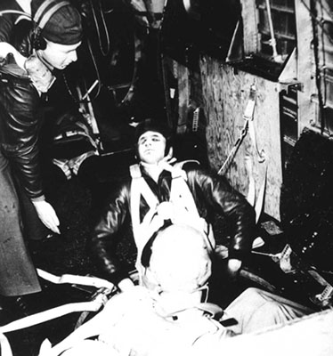 SOE operative sitting on the edge of the &ldquo;joe hole&rdquo; ready to parachute into German-occupied France.