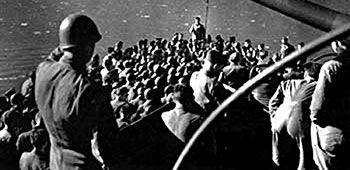 Lieutenant Colonel Darby addressing the Rangers at the beginning of the crossing to Sicily, 9 July 1943. The Rangers landed at Gela on 10 July 1943.