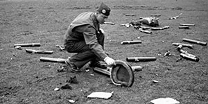 According to the original caption written on the back of this photo, not one of the Bazooka rounds exploded during this free-drop test.