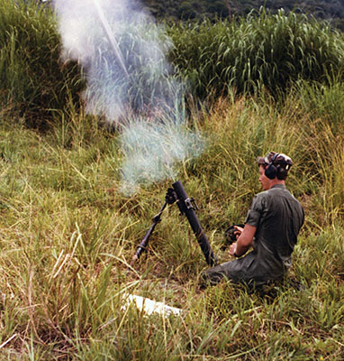 Staff Sergeant Gary Davidson fires the 60mm mortar during the ODA-7 &ldquo;Gun-a-Rama&rdquo; at Empire Range in Panama.