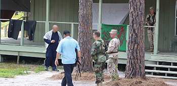 Students meet with Freedom Village officials, a tribal elder, the Imam, and the police chief.